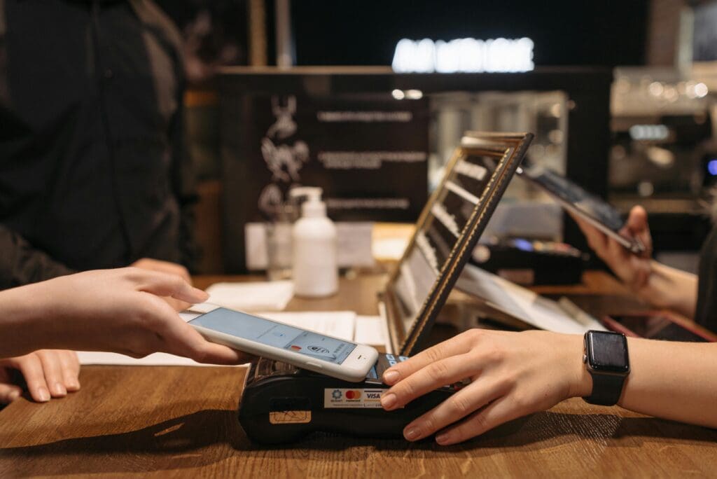 Customer paying invoice with his phone